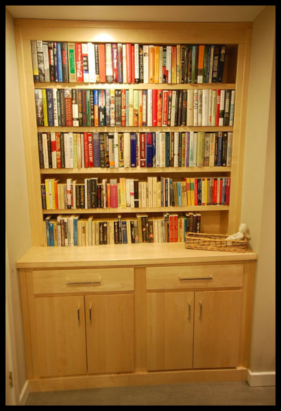 Custom Maplewood secretary with clear coat finish; 1.5-inch thick tabletop, double doors, drawers, and open shelving.