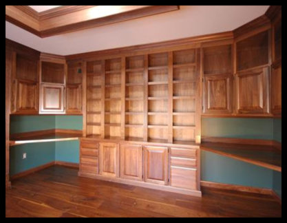 Custom solid walnut floor-to-ceiling cabinetry featuring a five-bay open bookcase atop seamless base cabinets.
