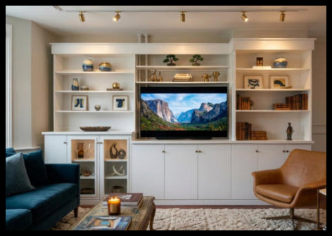 Large-scale 12-foot entertainment center with slab door storage, integrated cabinetry, and open-face bookcases. Built-in design with premium clear coat finish; no particle board used.